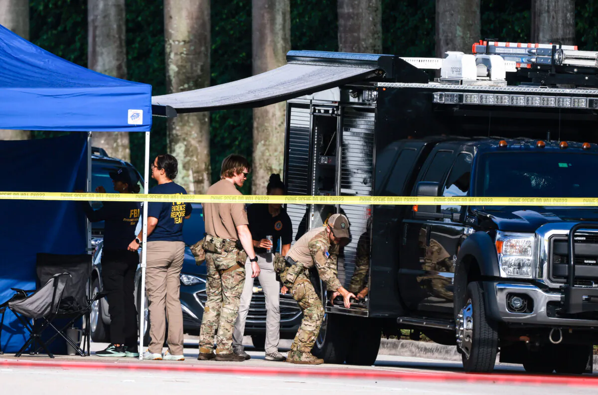 Law enforcement personnel continue to investigate the area around Trump International Golf Club after an apparent assassination attempt on former President Donald Trump in West Palm Beach on Sept. 16, 2024. (Joe Raedle/Getty Images)