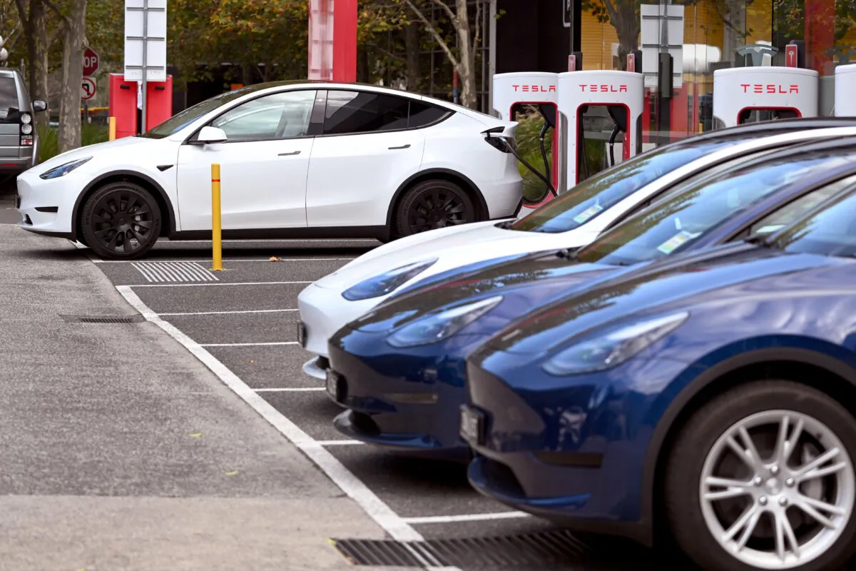 Electric vehicles (EV) line up outside a Tesla dealership in Melbourne, Australia, on April 19, 2023. (William West/AFP via Getty Images)