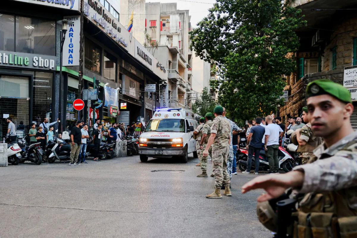 Ambulances are surrounded by people at the entrance of the American University of Beirut Medical Center, on Sept. 17, 2024, after explosions at locations throughout Lebanon.(Anwar Amro/AFP via Getty Images)
