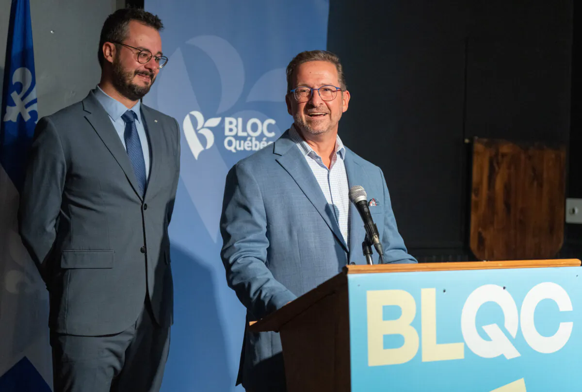 Bloc Québécois Leader Yves-Francois Blanchet (R) and newly elected candidate Louis-Philippe Sauve smile as they speak to the media in Montreal on Sept. 17, 2024. The Bloc Quebecois won the Montreal Liberal stronghold riding of LaSalle-Emard-Verdun after an extremely tight three-way race with the NDP. (The Canadian Press/Christinne Muschi)