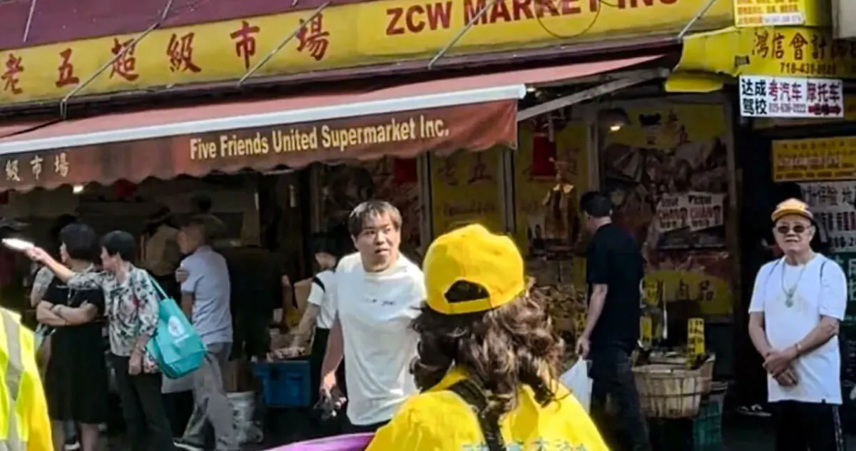 A man (C) accused of attacking several Falun Gong practitioners during and after a parade in Brooklyn, New York, on Sept. 14, 2024. (Courtesy of Tuidang Center)
