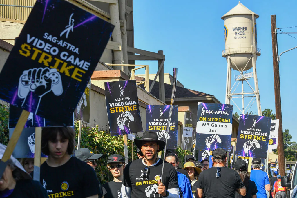 SAG-AFTRA union video game performers strike outside Warner Bros. Games, part of Warner Bros. Discovery, in Burbank, Calif., on Aug. 1, 2024. (Valerie Macon/AFP via Getty Images)