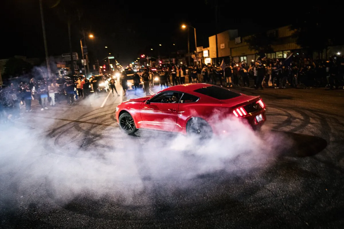 Dodgers fans celebrate after a win in Los Angeles on Oct. 27, 2020. (Brandon Bell/Getty Images)