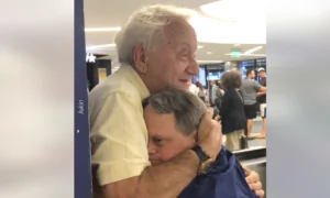 Father and Son Hug After Reuniting at the Airport