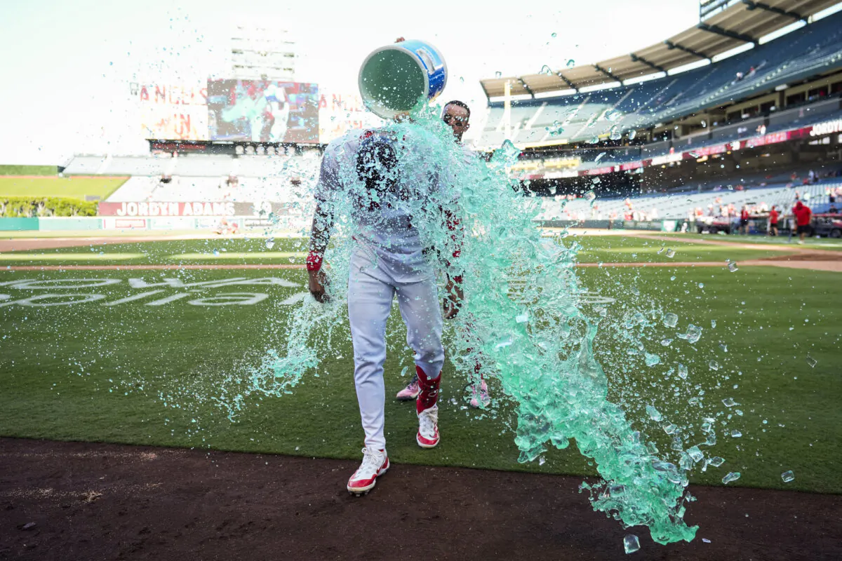 Los Angeles Angels' Jordyn Adams is doused after a walk-off single to win 4-3 against the Chicago White Sox in a baseball game in Anaheim, Calif., Wednesday, Sept. 18, 2024. (AP Photo/Ashley Landis)
