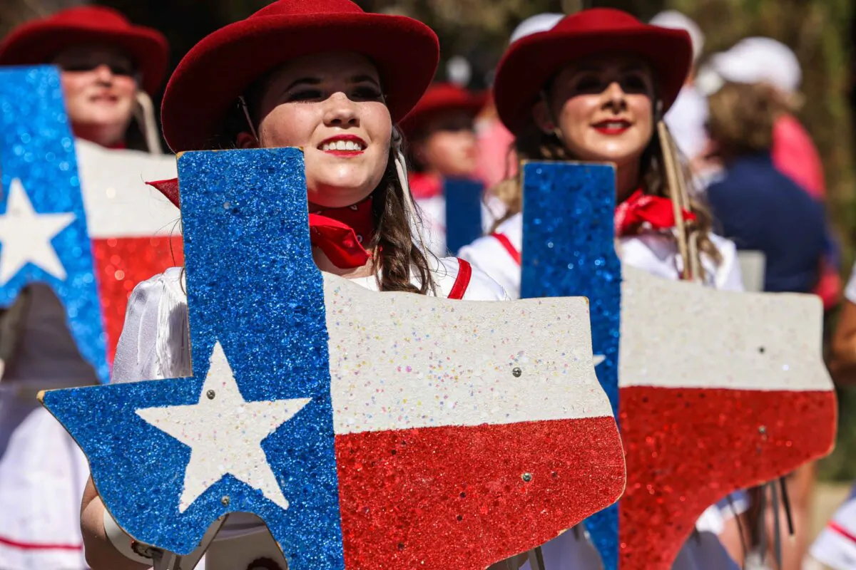 Participants march in the annual Opening Day Parade at the State Fair of Texas in Dallas on Friday, Sept. 24, 2021. This year's fair opens Sept. 27. (Lola Gomez/Dallas Morning News/TNS)