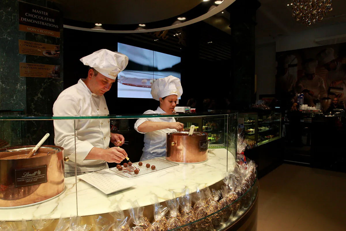 Staff members prepare chocolate at the Lindt Cafe in Sydney, Australia, on March 20, 2015. (Lisa Maree Williams/Getty Images)