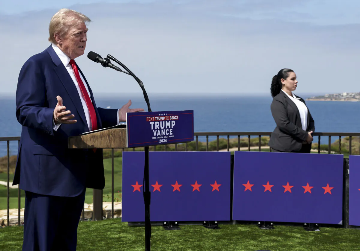 Former President Donald Trump speaks near a Secret Service agent during a press conference at Trump National Golf Club Los Angeles, in Rancho Palos Verdes, Calif., on Sept. 13, 2024. (Mario Tama/Getty Images)