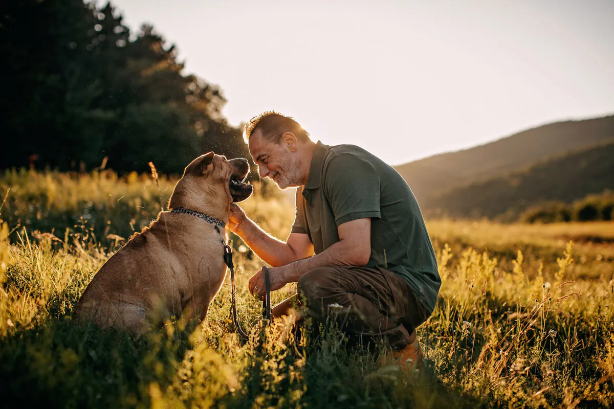 The secret to aging gracefully for both pets and humans is to stay physically and mentally active, eat right, and spend lots of quality time together. (supersizer/Getty Images)