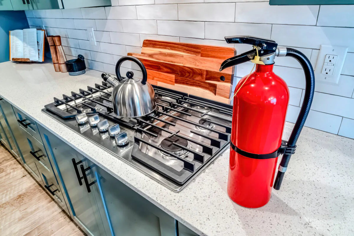 Fire extinguishers are a vital part of home ownership, and one should always be kept in the kitchen. (Jason Finn/Dreamstime/TNS)