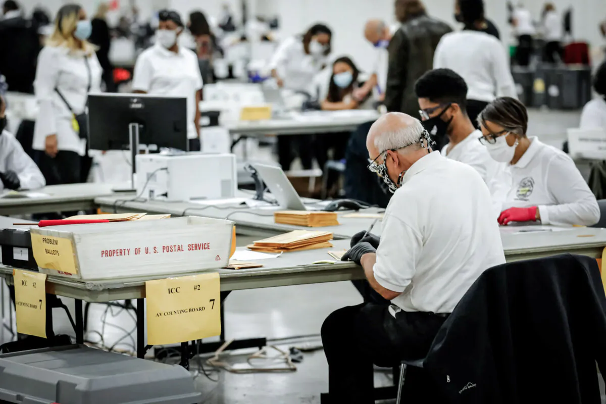 Election workers count absentee ballots for the 2020 general election at TCF Center in Detroit on Nov. 4, 2020. (Jeff Kowalsky/AFP via Getty Images)