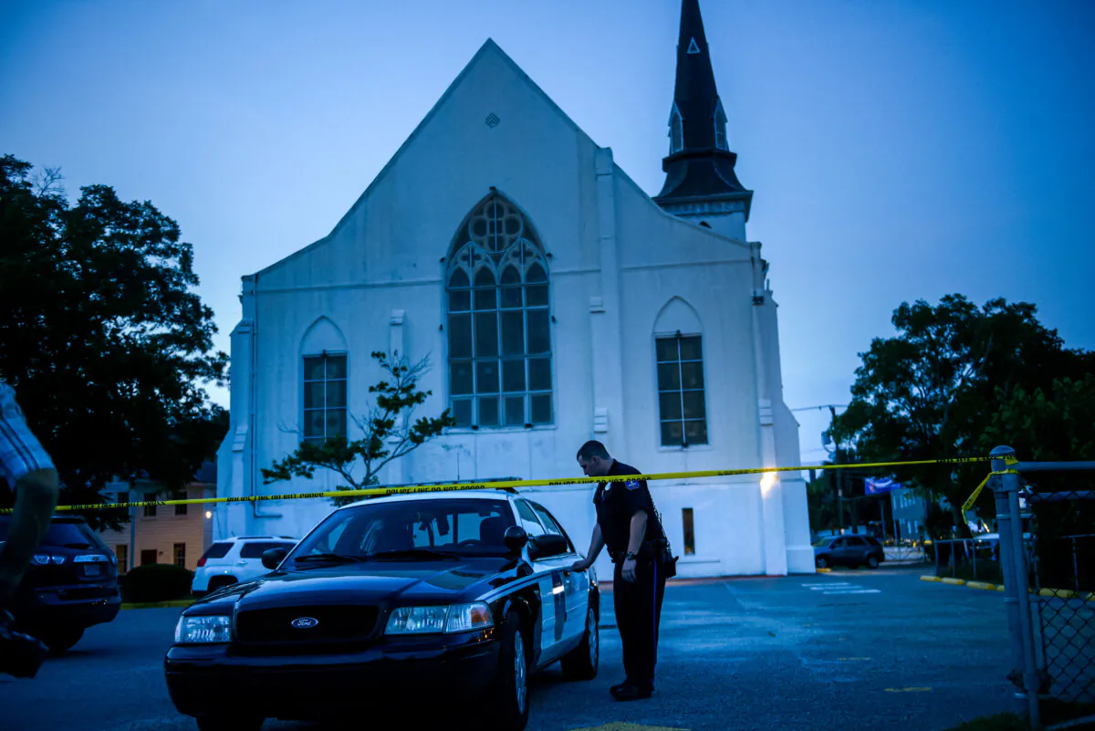 A police officer stands guard outside Emanuel AME Church after a shooting took place, in Charleston, S.C., on June 20, 2015. (Brendan Smialowski/AFP via Getty Images)