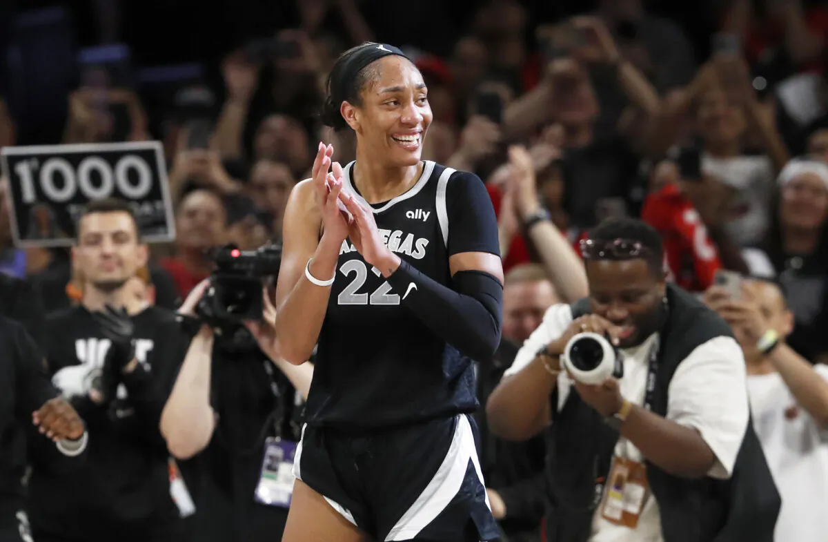 Las Vegas Aces center A'ja Wilson (22) celebrates during the second half of a WNBA basketball game against the Connecticut Sun in Las Vegas on Sept. 15, 2024. (Steve Marcus/Las Vegas Sun via AP)