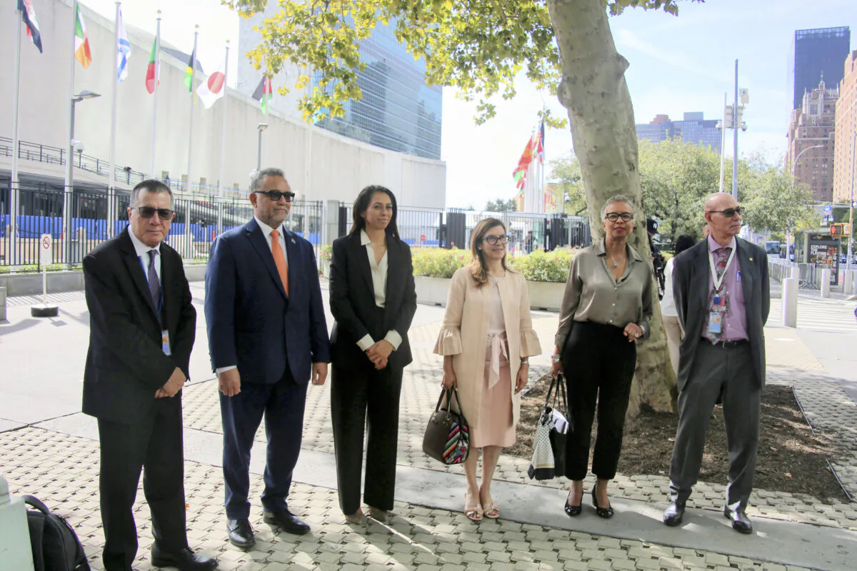 (L-R) U.N. Permanent Representatives—John Silk from Marshall Islands, Tapugao Falefou from Tuvalu, Ilana Seid from Palau, Carla María Rodríguez Mancia from Guatemala, Inga Rhonda King from Saint Vincent and the Grenadines, and Carlos Fuller from Belize—join for a group photo outside of the U.N. headquarters after delivering a letter to the U.N. secretary-general’s office, in New York, on Sept. 19, 2024. (Edwin Huang/The Epoch Times)
