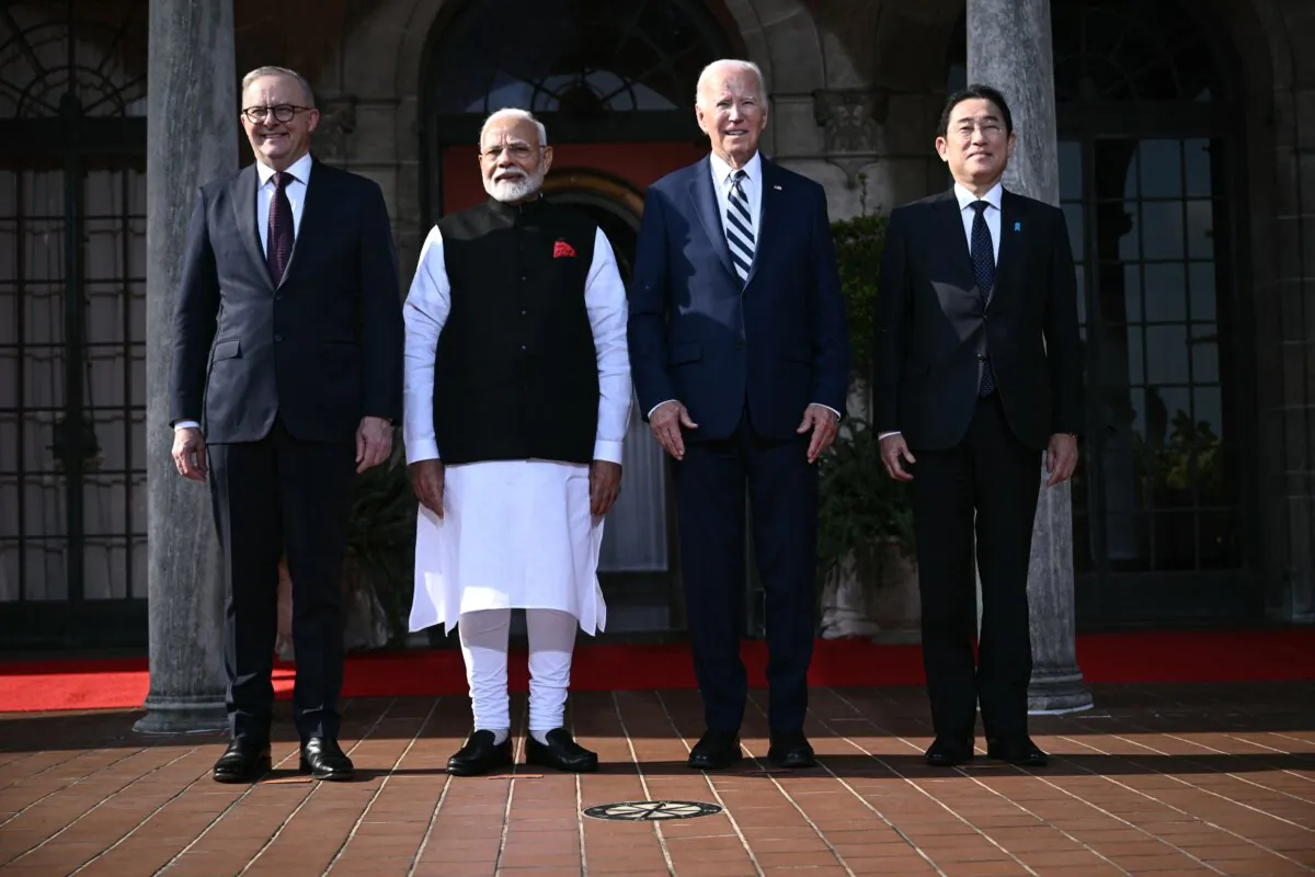 U.S. President Joe Biden (3rd R) participates in a Quadrilateral Summit family photo with Australian Prime Minister Anthony Albanese (L), Indian Prime Minister Narendra Modi (2nd L), and Japanese Prime Minister Fumio Kishida (R) at the Archmere Academy in Wilmington, Del., on Sept. 21, 2024. (Brendan Smialowski/AFP via Getty Images)