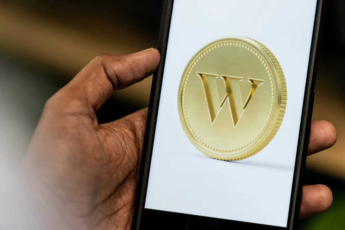 An app screenshot for Wealthsimple is seen on a smartphone in a photo illustration made in Toronto, on June 17, 2024. (The Canadian Press/Giordano Ciampini)