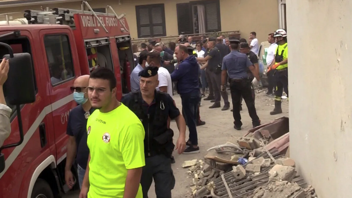 Emergency services attend the site of a building collapse in Saviano, Italy, on Sept. 22, 2024. (LaPresse via AP)