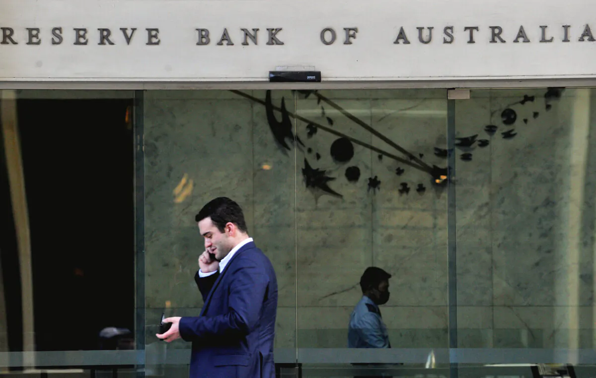 A man walks past the Reserve Bank of Australia in the central business district of Sydney on June 7, 2022. - Australia's central bank raised interest rates by a higher-than-expected half percentage point on June 7 and warned of more increases, trying to rein in "significantly" increased inflation. (Photo by Muhammad FAROOQ / AFP) (Photo by MUHAMMAD FAROOQ/AFP via Getty Images)
