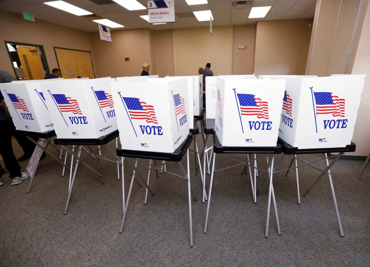 Poll workers set up early voting equipment at the Seffner-Mango Branch Library in Seffner, Fla., on Aug. 2, 2024. (Reuters/Octavio Jones/File photo)