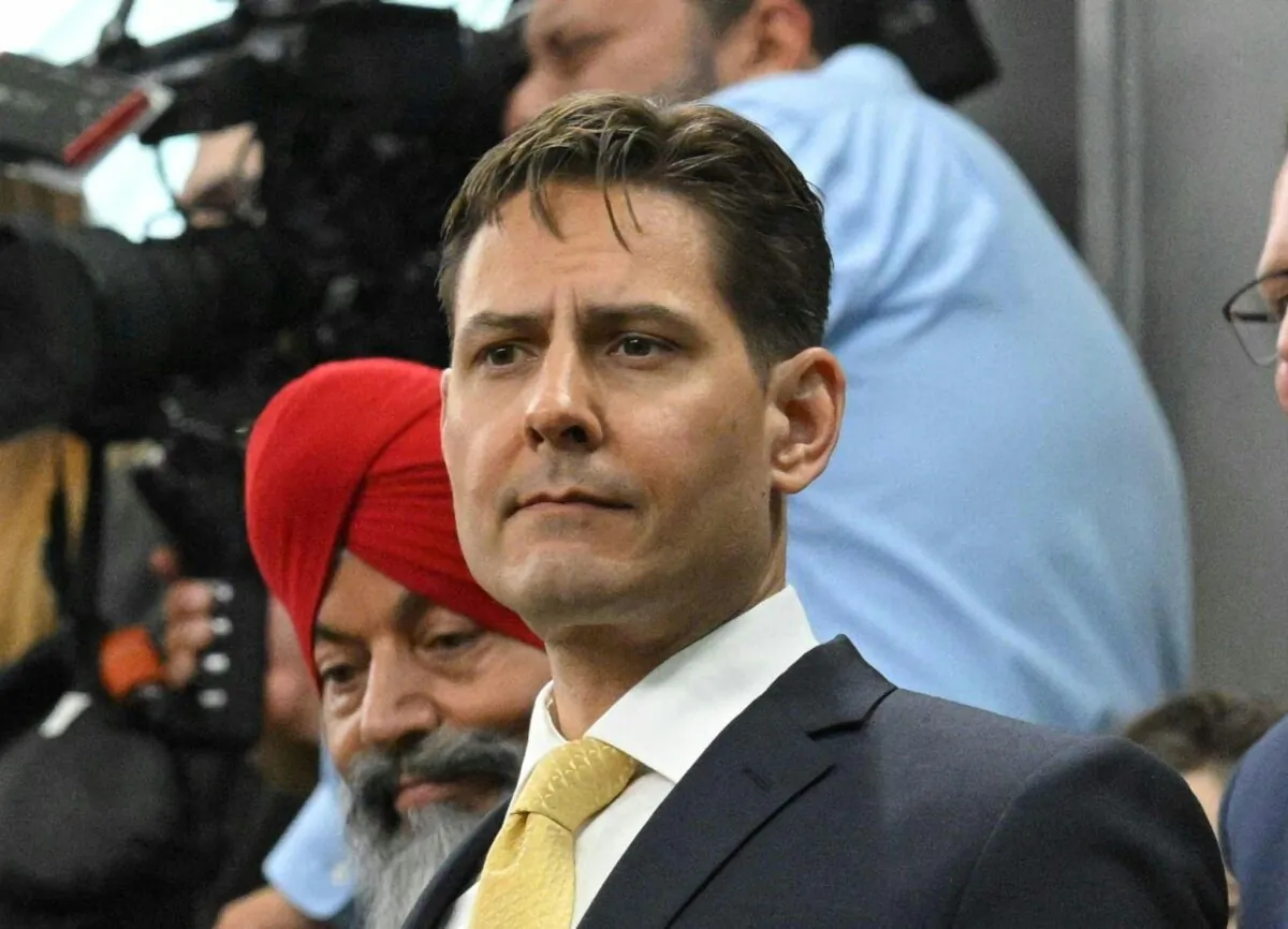 Michael Kovrig stands as he and Michael Spavor are recognized before an address by U.S. President Joe Biden in the House of Commons in Ottawa on March 24, 2023. (Mandel Ngan/POOL/AFP via Getty Images)