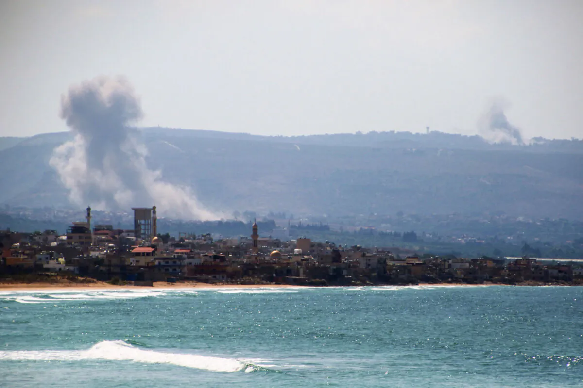 Smoke billows after an Israeli strike on the area of el-Hosh near port city of Tyre in southern Lebanon on September 24, 2024. Israel announced dozens of new air strikes on Hezbollah strongholds in Lebanon on September 24, a day after 492 people, including 35 children, were killed in the deadliest bombardment since a devastating war in 2006. (Photo by HASSAN FNEICH / AFP) (Photo by HASSAN FNEICH/AFP via Getty Images)