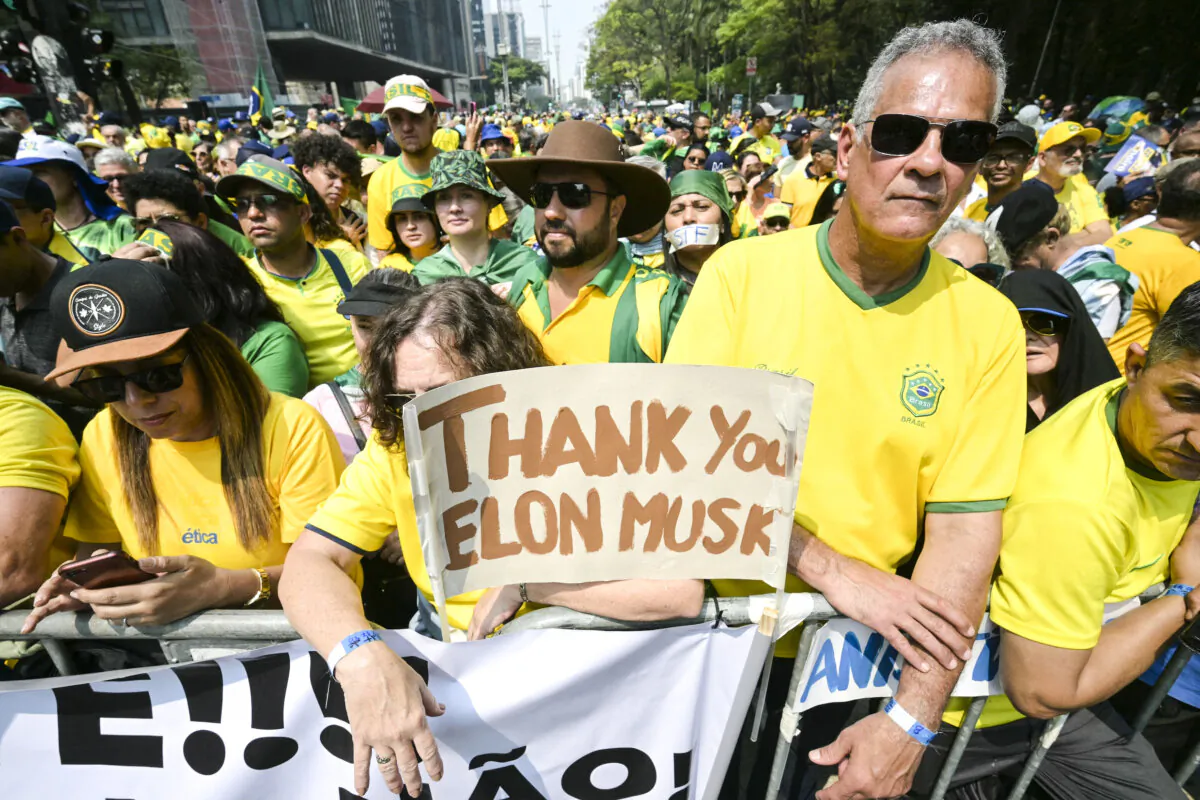 Supporters of former Brazilian President Jair Bolsonaro hold a sign thanking X social media platform owner Elon Musk, during an independence day rally in Sao Paulo, Brazil, on Sept. 7, 2024. (Nelson Almeida/AFP via Getty Images)