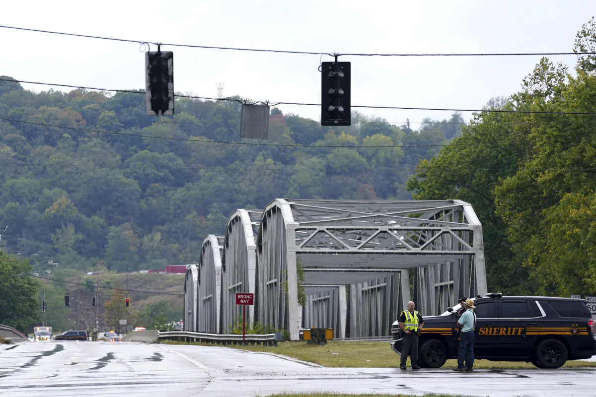 A sheriff's vehicle blocks a road closure at U.S. Route 50 and Ohio State Route 128 in Whitewater Township near Cleves, Ohio, due to chemical leak from a railcar on Sept. 24, 2024. (Frank Bowen IV/The Cincinnati Enquirer via AP)