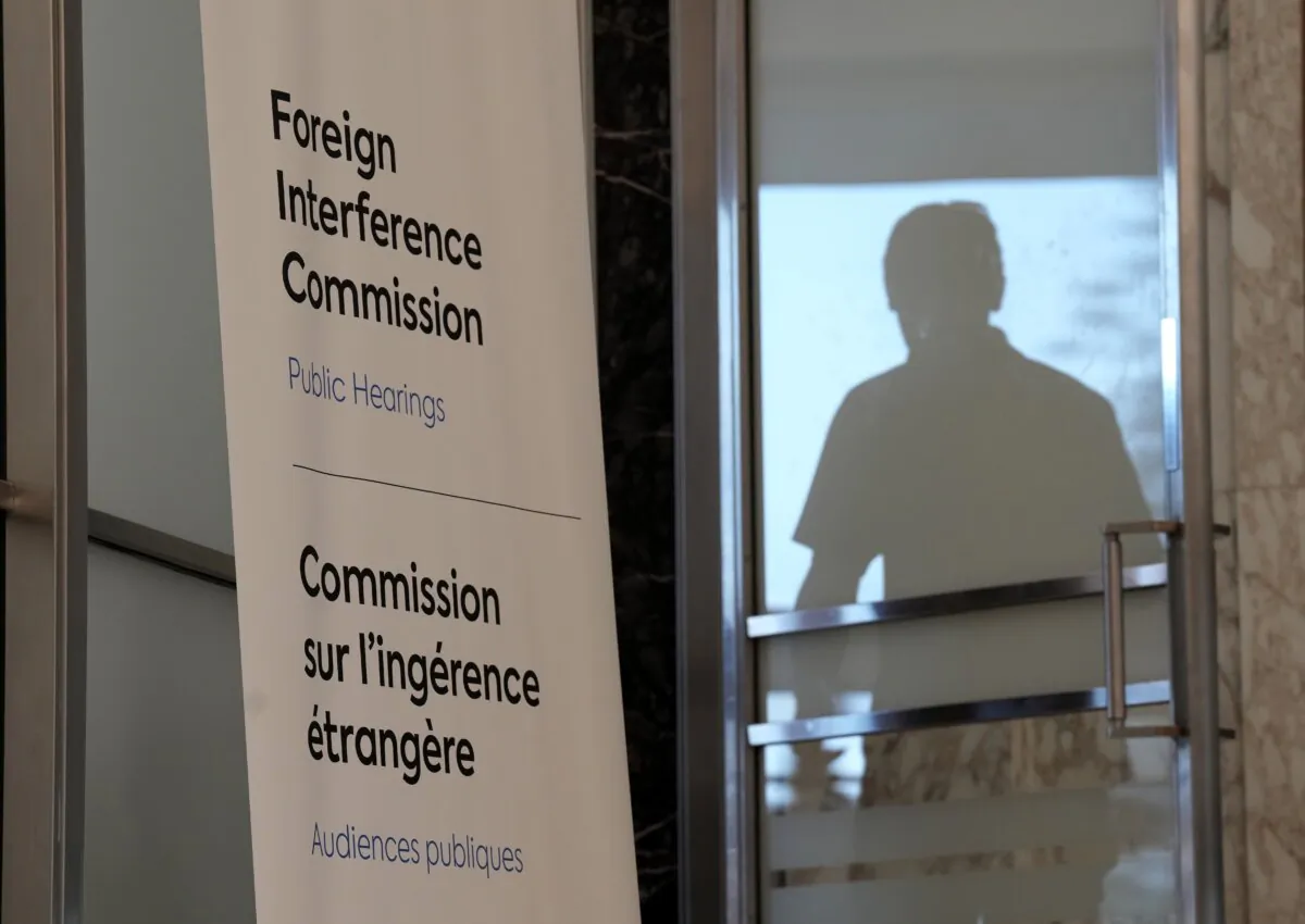 A man enters the hearing room during the Public Inquiry into Foreign Election Interference in Ottawa on Sept. 16, 2024. (The Canadian Press/Adrian Wyld)