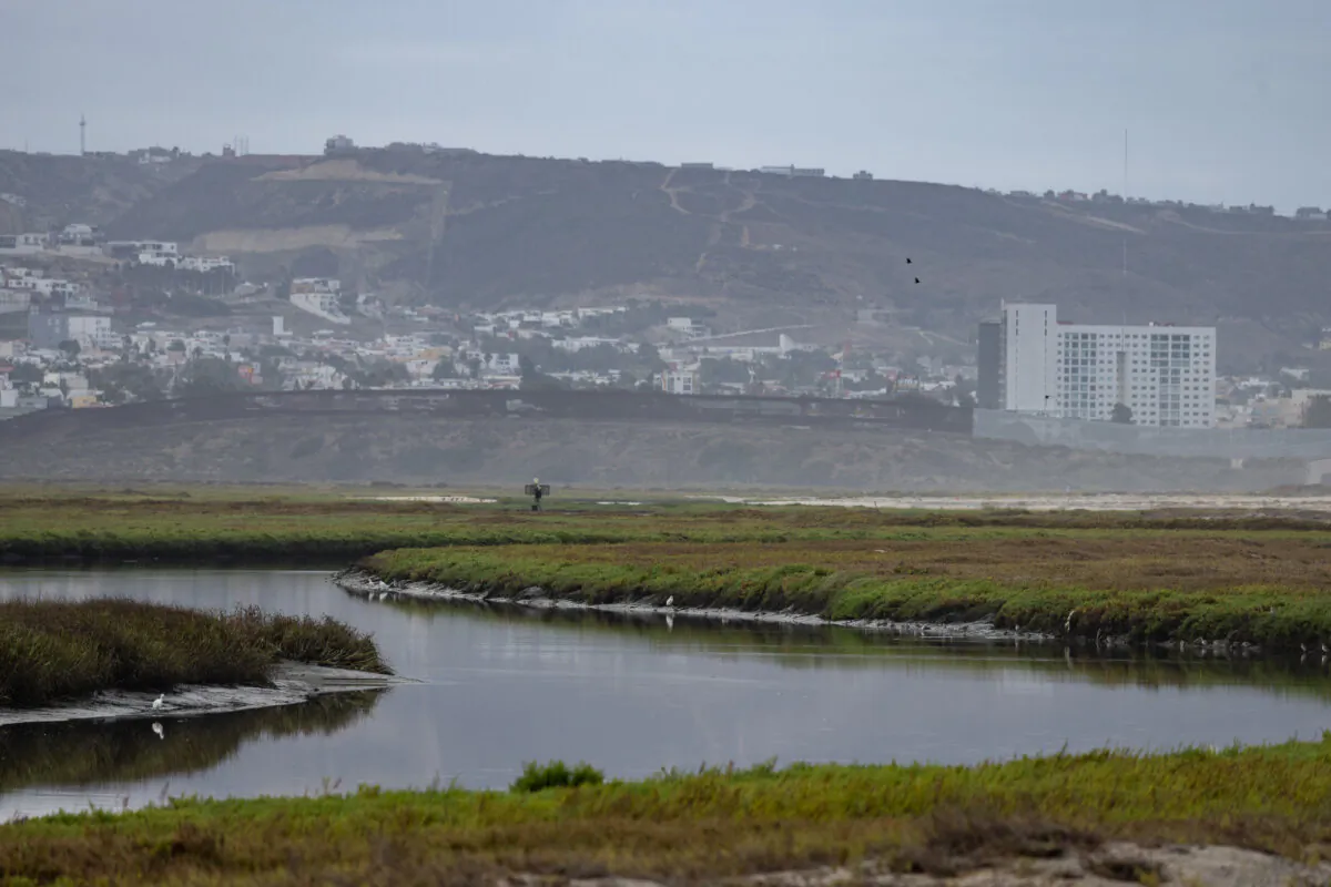 The Tijuana River flows within sight of the US-Mexico border in Imperial Beach, Calif., on Sept. 19, 2024. (John Fredricks/The Epoch Times)