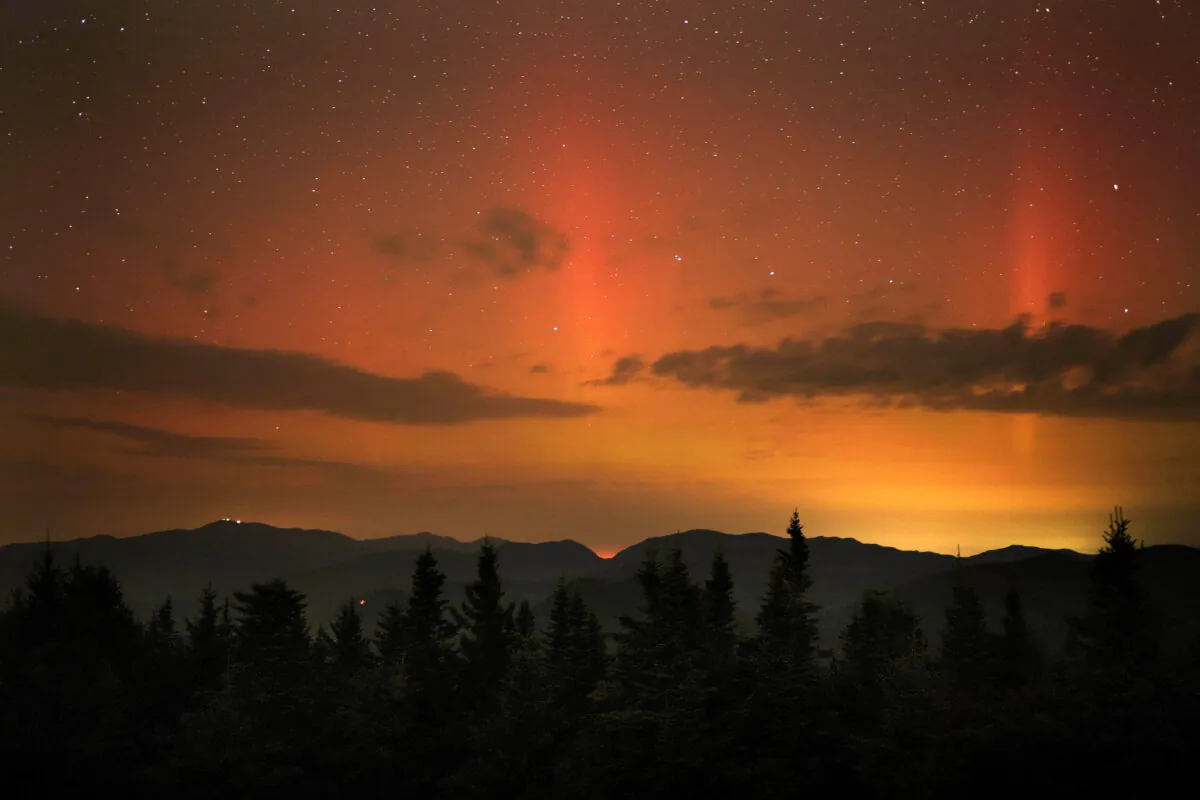 Flares of northern lights color the sky over the White Mountains just after midnight on Sept. 13, 2024. (Robert F. Bukaty/AP Photo)