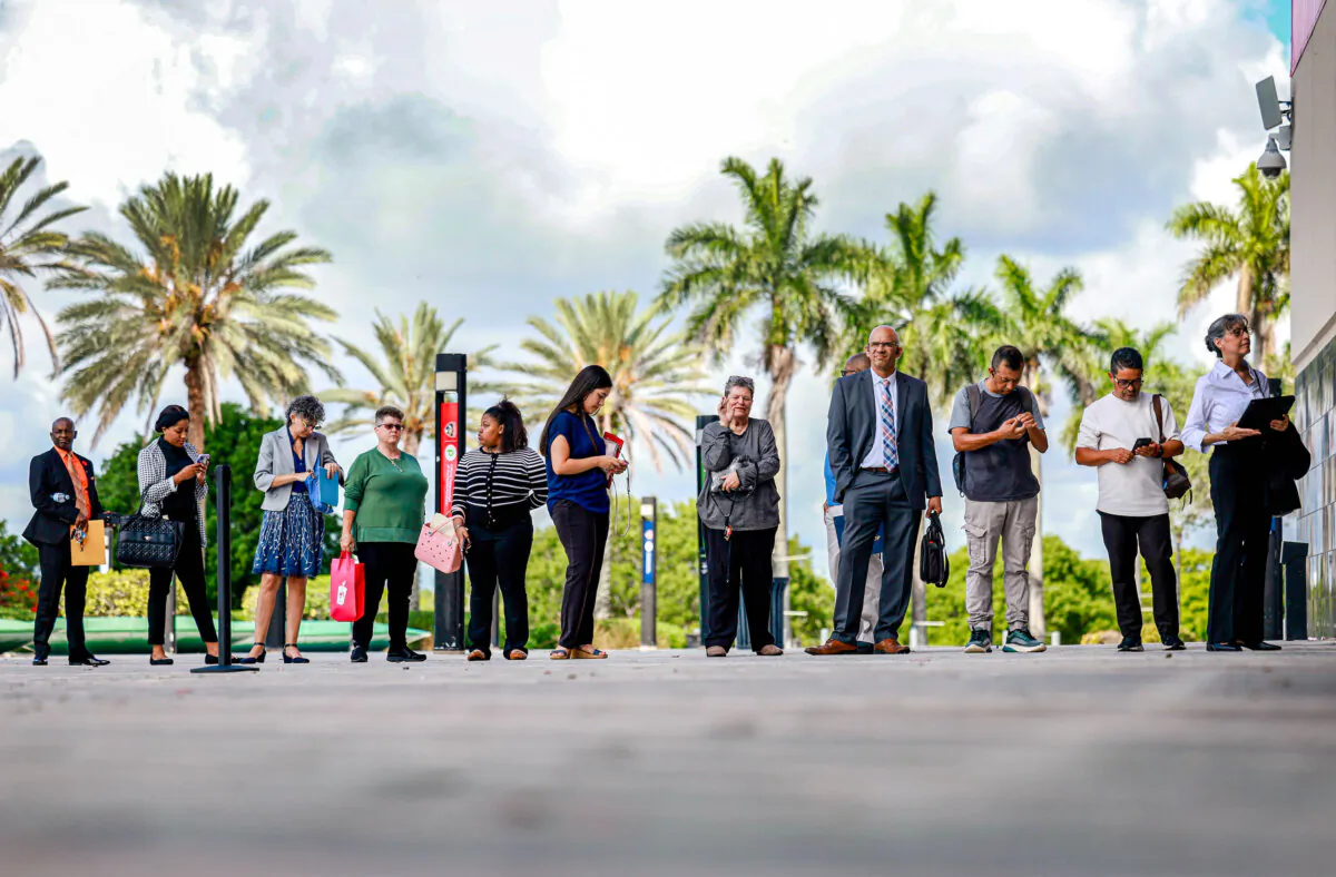 People wait in line for a job fair to open in Sunrise, Fla., on June 26, 2024. (Joe Raedle/Getty Images)

