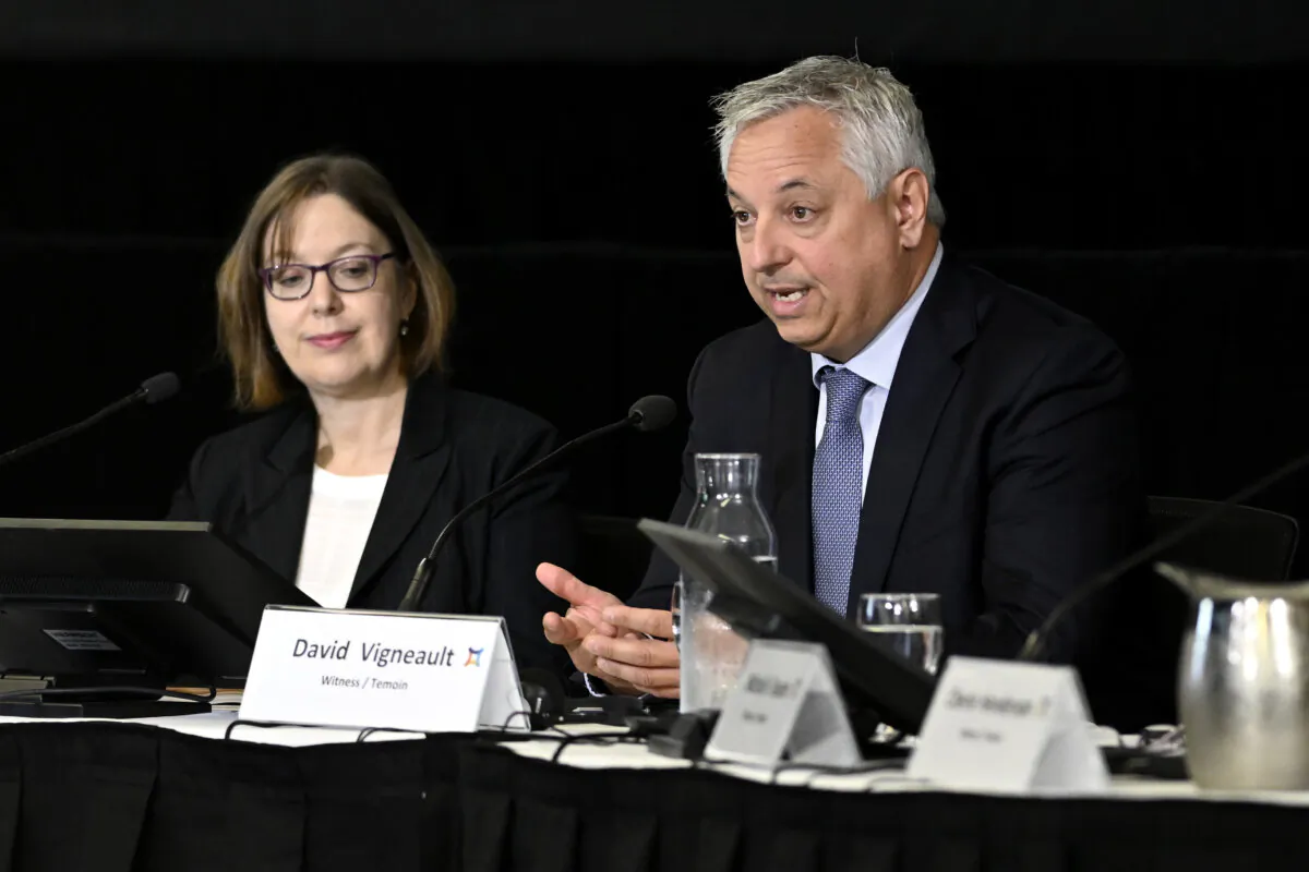 Vanessa Lloyd, interim director at the Canadian Security Intelligence Service, left, listens as former director David Vigneault, responds to a question at the Foreign Interference Commission in Ottawa on Sept. 27, 2024. (Justin Tang/The Canadian Press)