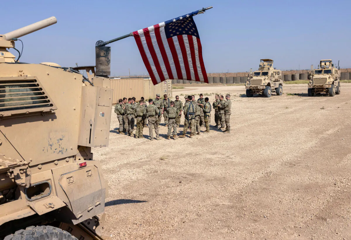 U.S. Army soldiers prepare to go out on patrol from a remote combat outpost in northeastern Syria on May 25, 2021. (John Moore/Getty Images)