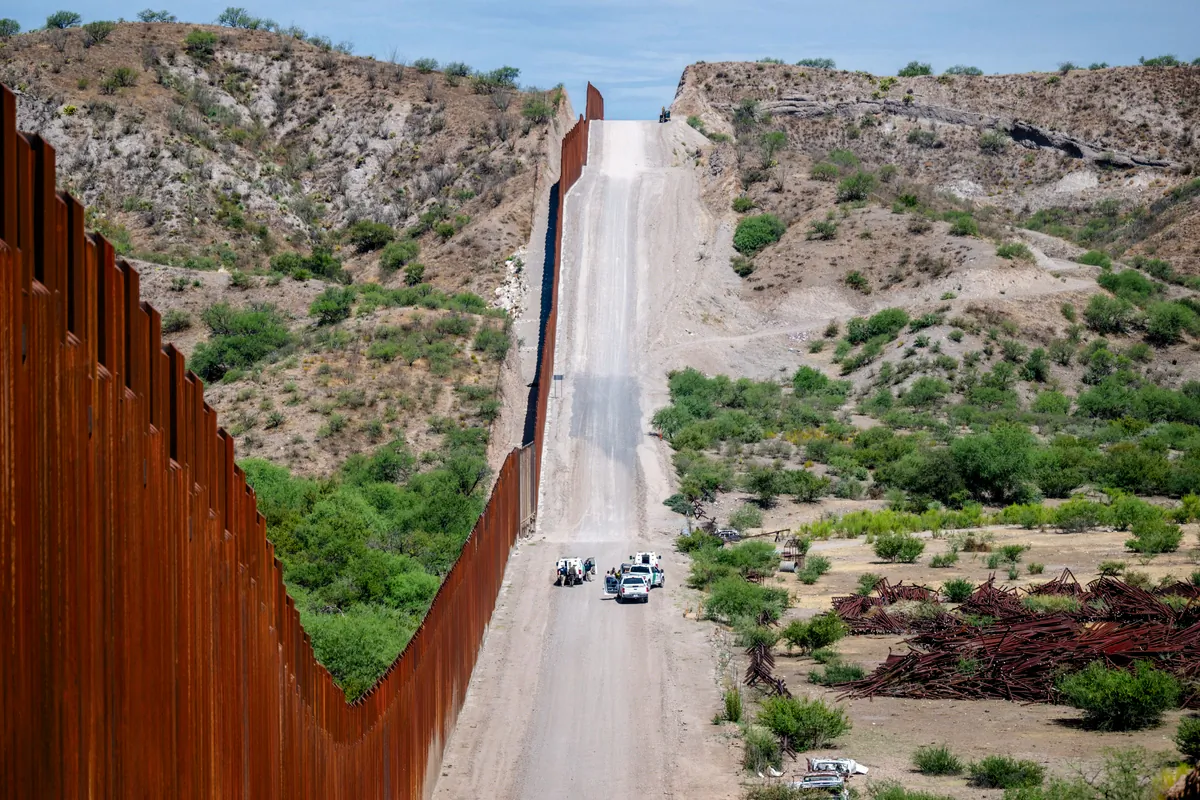 A group of illegal immigrants are apprehended by U.S. Customs and Border protection officers after crossing over into the United States, in Ruby, Ariz., on June 26, 2024. (Brandon Bell/Getty Images)