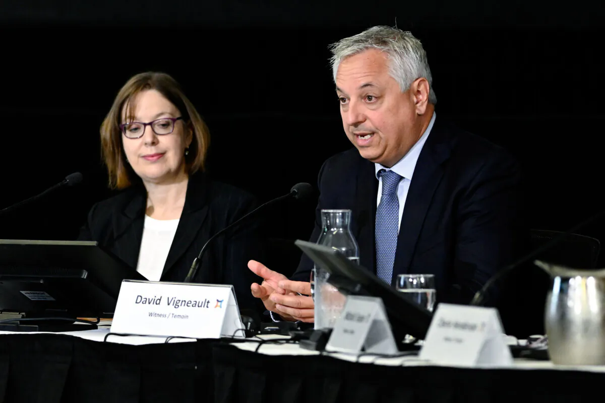 Vanessa Lloyd, interim director at the Canadian Security Intelligence Service (L) listens as former director David Vigneault responds to a question at the Foreign Interference Commission in Ottawa on Sept. 27, 2024. (Justin Tang/The Canadian Press)