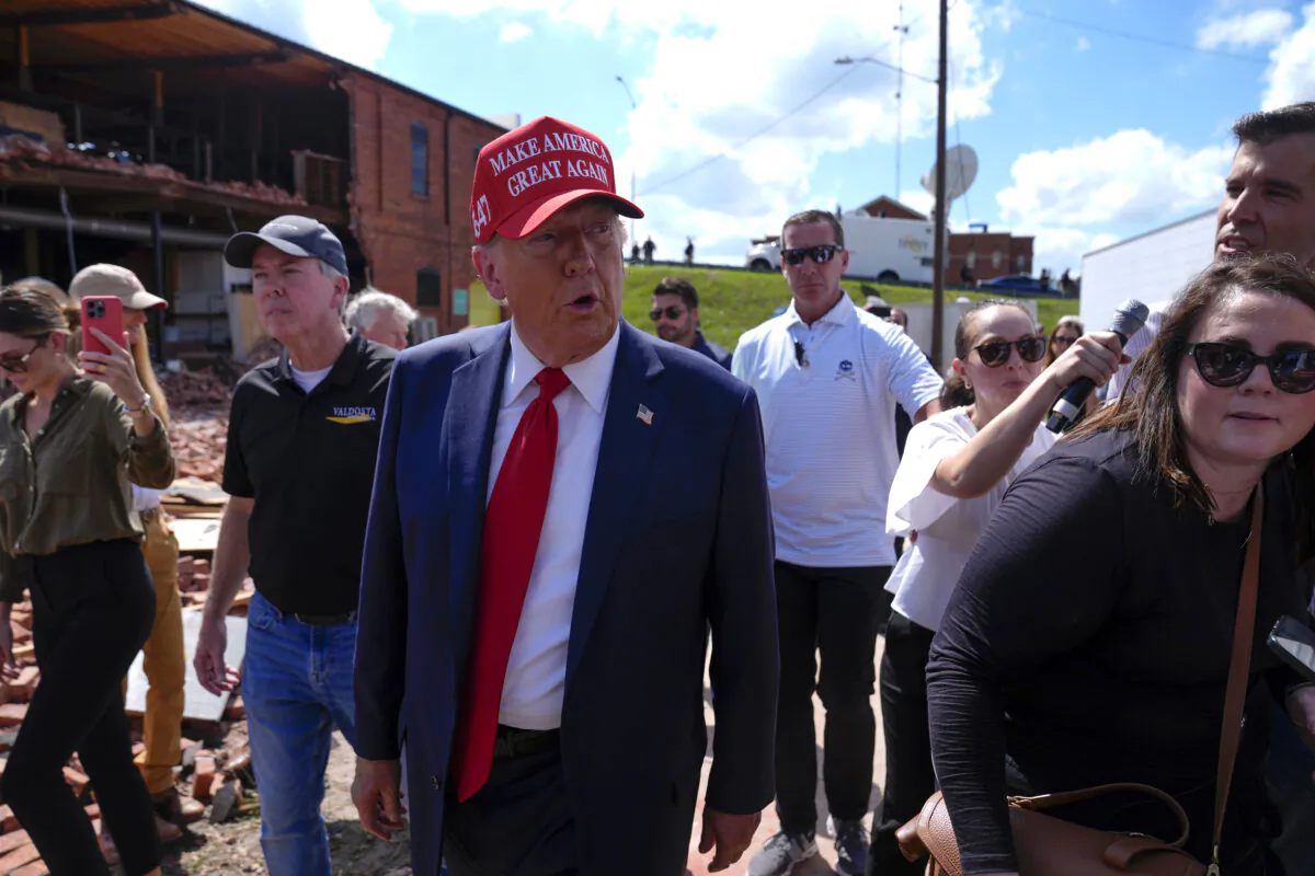 Republican presidential nominee former President Donald Trump walks outside the Chez What furniture store as he visits Valdosta, Ga., a town impacted by Hurricane Helene, on Sept. 30, 2024. (Evan Vucci/AP Photo)