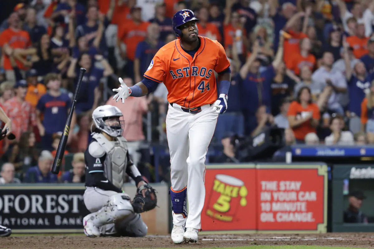 Houston Astros' Yordan Alvarez (44) flips his bat as he watches his three-run home run in front of Arizona Diamondbacks catcher Jose Herrera, left, during the fifth inning of a baseball game  in Houston, on Sept. 6, 2024. (Michael Wyke/AP Photo)