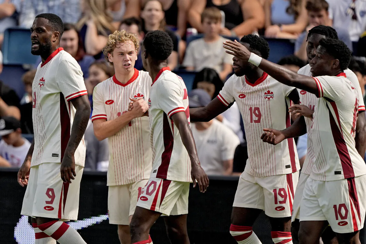 Canada forward Jacob Shaffelburg, second from left, celebrates with teammates after scoring a goal during the first half of an international friendly soccer game against United States in Kansas City, Mo. on Sept. 7, 2024. (Charlie Riedel/AP Photo)