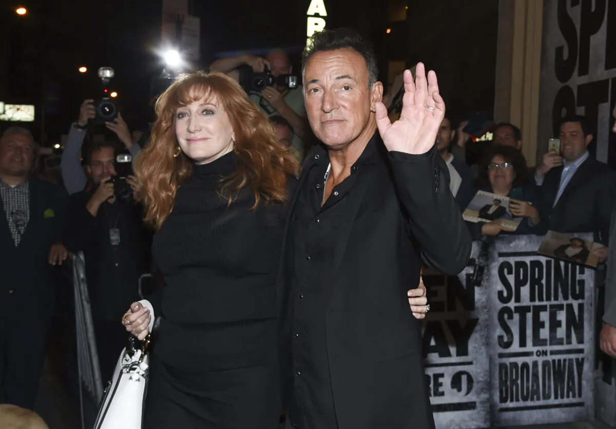 Musician Bruce Springsteen and his wife Patti Scialfa exit the stage door after the opening night performance of "Springsteen on Broadway" at the Walter Kerr Theatre in New York on Oct. 12, 2017. (Evan Agostini via Invision/AP Photo)