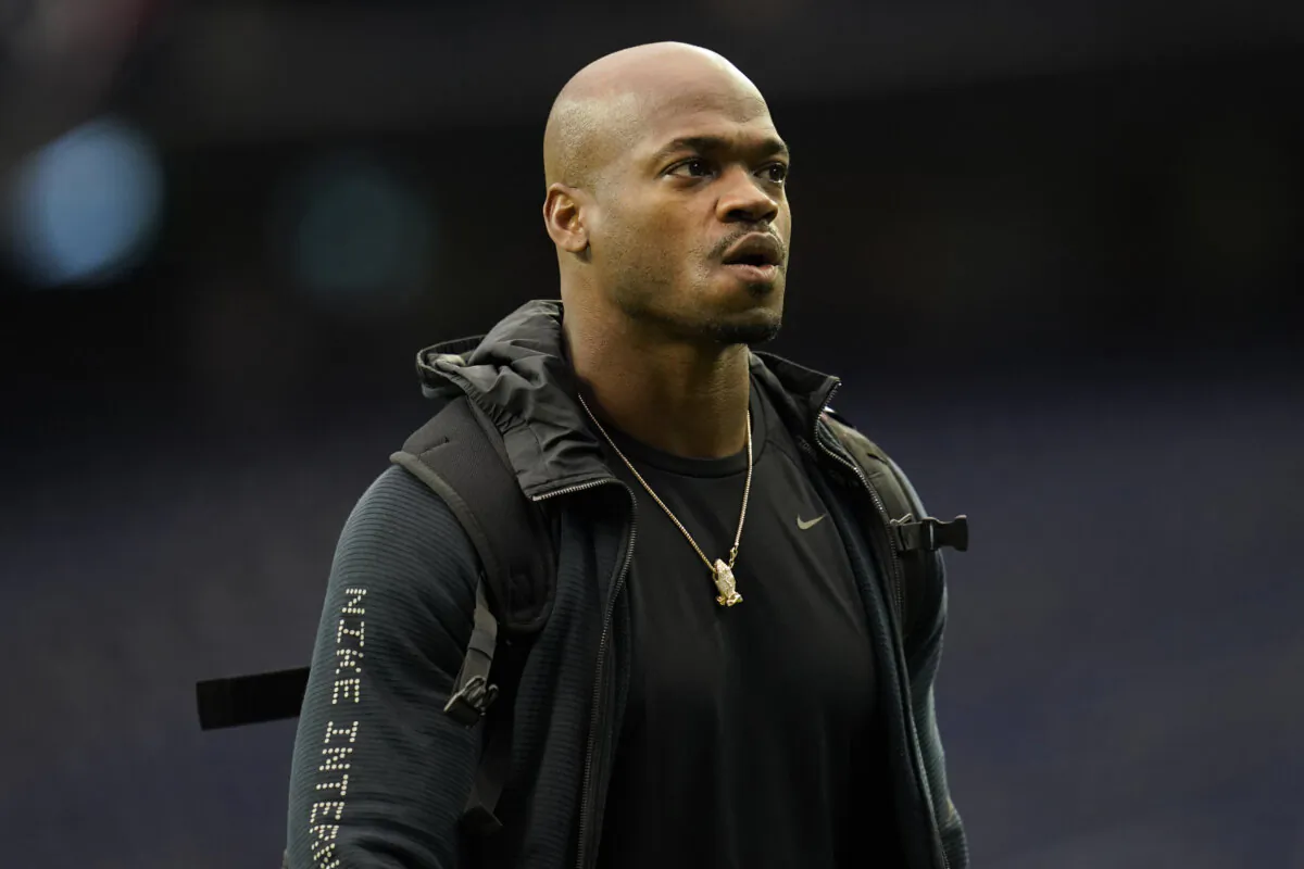 FILE - Seattle Seahawks running back Adrian Peterson looks on during player arrivals before an NFL football game against the Houston Texans, Dec. 12, 2021, in Houston. (AP Photo/Matt Patterson, File)