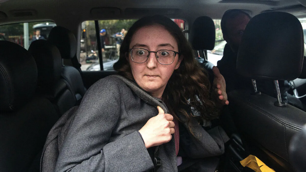 Caroline Ellison former CEO of Alameda Research founded by Sam Bankman-Fried goes into a wrong car as she exits the Manhattan federal court after testifying on Tuesday, Oct. 10, 2023, in New York. (Eduardo Munoz Alvarez/AP Photo)