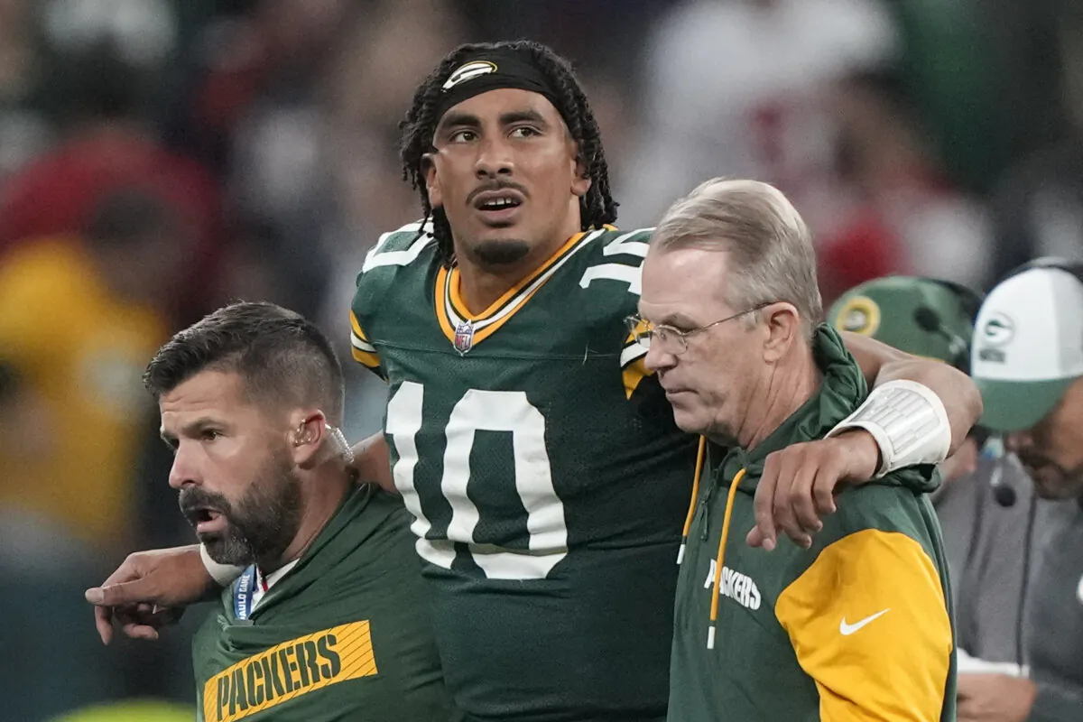 Green Bay Packers quarterback Jordan Love (10) in helped off the field after getting hurt during the second half of an NFL football game against the Philadelphia Eagles, at the Neo Quimica Arena in Sao Paulo, on Sept. 7, 2024. (Doug Benc/AP Photo)