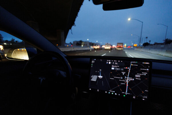 Tesla Model 3 Drives On Autopilot Along California Freeway