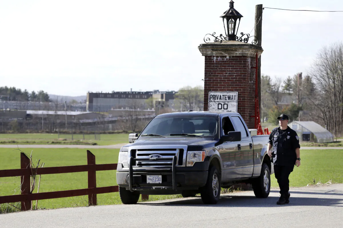 A police officer guards an entrance to the Souza-Baranowski Correctional Center in Shirley, Mass., on April 19, 2017. (Elise Amendola/AP Photo)