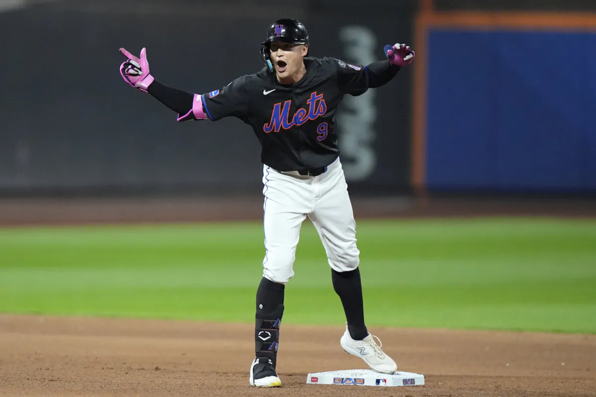 New York Mets' Brandon Nimmo (9) gestures to teammates after hitting an RBI double during the fourth inning of a baseball game against the Philadelphia Phillies in New York on Sept. 19, 2024. (Frank Franklin II/AP Photo)
