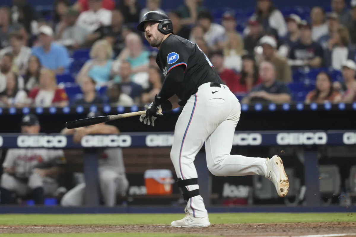 Miami Marlins' Jake Burger (36) hits a single to left field during the third inning of a baseball game against the Atlanta Braves in Miami, on Sept. 20, 2024. (Marta Lavandier/AP Photo)