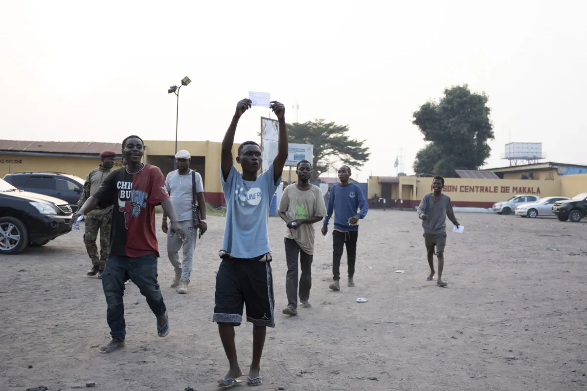 Some of the 600 prisoners released from Democratic Republic of the Congo's capital Kinshasa's Makala Central Prison react, on Sept. 21, 2024. (Samy Ntumba Shambuyi/AP Photo)