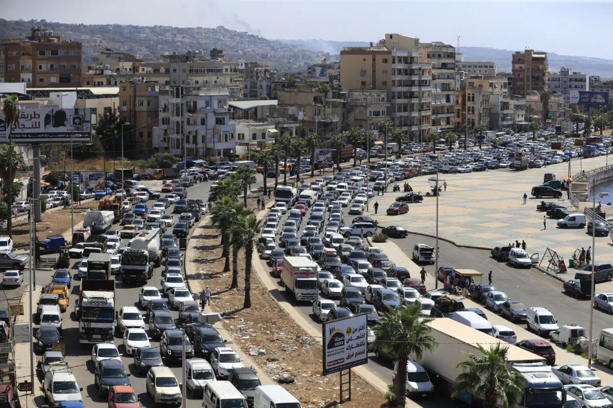 Cars sit in traffic as they flee the southern villages amid ongoing Israeli airstrikes, in Sidon, Lebanon, on Sept. 23, 2024. (AP Photo/Mohammed Zaatari)