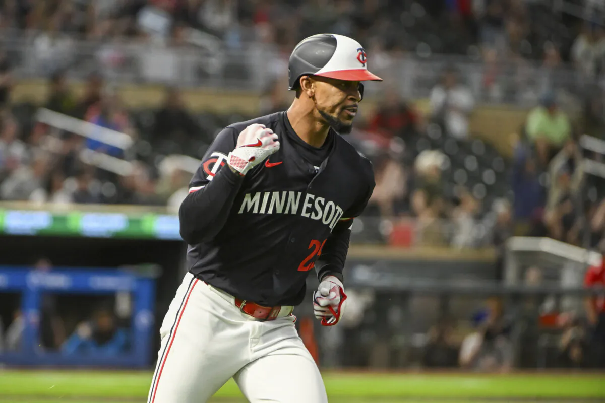Minnesota Twins' Byron Buxton celebrates as he rounds the bases after hitting a home run against Miami Marlins starting pitcher Edward Cabrera during the fourth inning of a baseball game in Minneapolis on Sept. 25, 2024. (Craig Lassig/AP Photo)