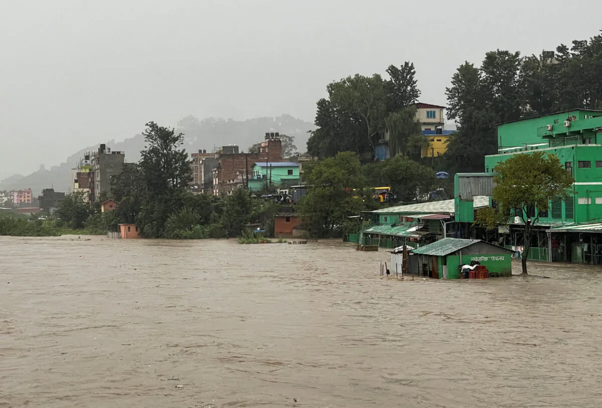 The overflowing Bagmati River following heavy rains, in Kathmandu, Nepal, on Sept. 27, 2024. (Navesh Chitrakar/Reuters)